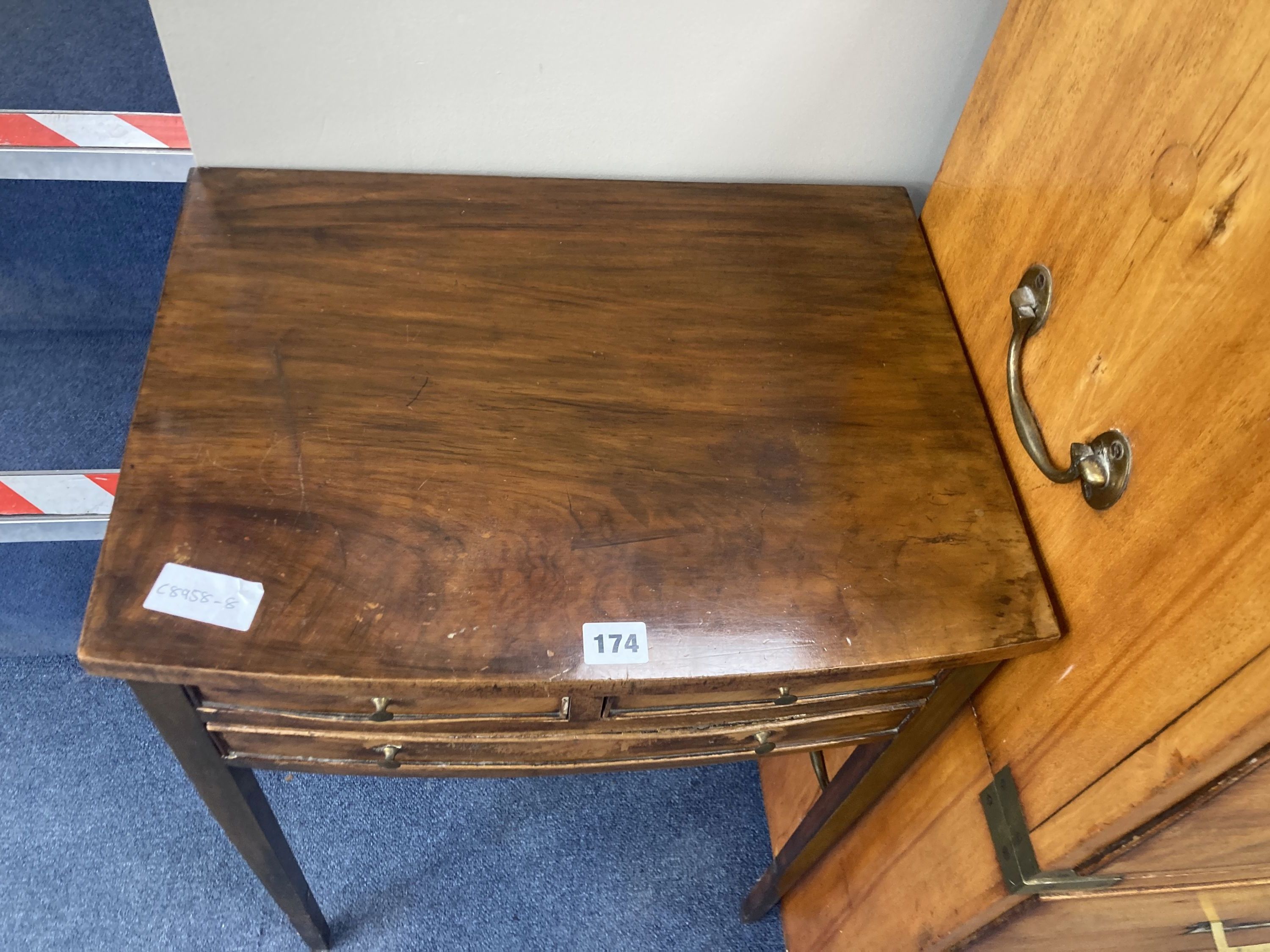 A George III style mahogany side table, fitted one long and two small drawers, width 48cm, depth 37cm, height 68cm